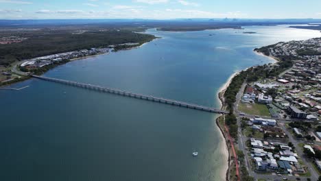 Aerial-View-Over-Bribie-Island-Bridge-In-Sandstone-Point,-Queensland,-Australia---Drone-Shot