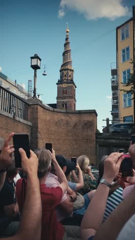 Vertical-view-of-Copenhagen's-church-tower-from-a-boat-canal-tour