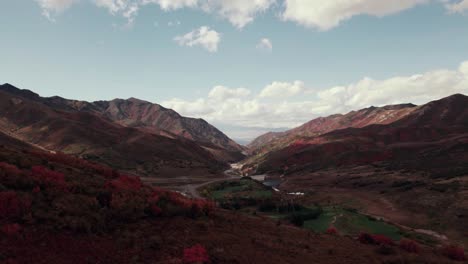 Aerial-drone-shot-of-Salt-Lake-City-mountain-range-with-fall-colored-leaves-at-60fps