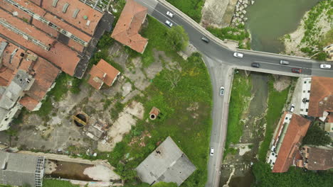 Flying-Above-Industrial-Ruins-And-Railroads-By-The-Arno-River-In-Le-Sieci,-Florence,-Italy