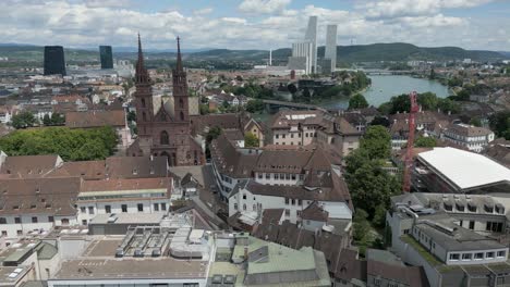 4K-Drone-Video-Rhine-River-dividing-the-Historic-and-Modern-Sections-of-Basel,-Switzerland