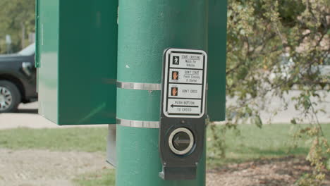 Crosswalk-button-on-the-campus-of-Michigan-State-University-in-East-Lansing,-Michigan