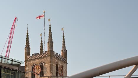 English-Flag-above-Southwark-Cathedral,-London,-United-Kingdom