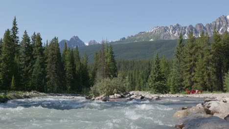 In-Banff-National-Park,-river-rushes-through-wild-heart-of-the-Rockies