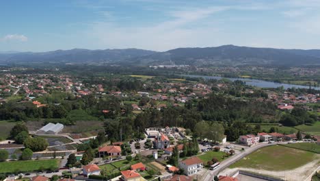 Serreleis-church-with-lush-countryside,-Lima-River,-and-rolling-hills-in-Viana-do-Castelo