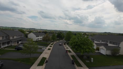 Drone-flight-over-luxury-housing-area-with-new-modern-houses-and-car-on-street