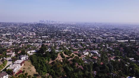 Breathtaking-aerial-view-of-Los-Angeles-from-the-surrounding-hills,-showcasing-the-vast-expanse-of-the-cityscape-and-the-beautiful-blend-of-urban-and-natural-landscapes