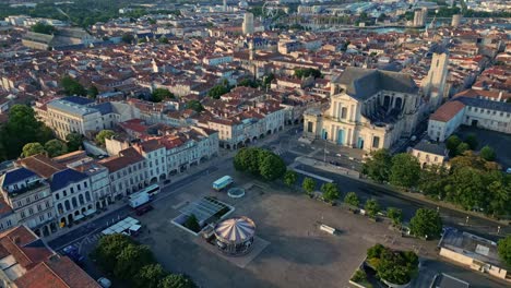 Receding-aerial-movement-about-the-La-Rochelle-Cathedral-and-Place-de-Verdun,-La-Rochelle,-France