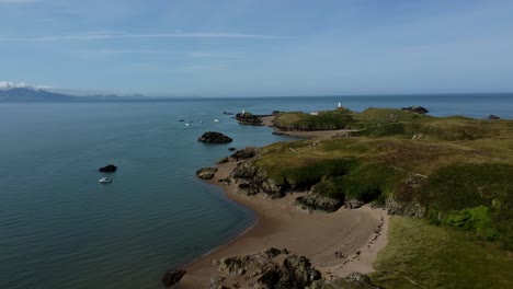 Aerial-view-rising-over-beautiful-Ynys-Llanddwyn-peaceful-Welsh-island-beach