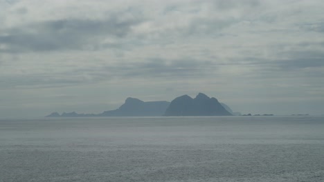 Distant-view-of-Mosken-Island-in-Lofoten,-Norway-on-a-cloudy-day