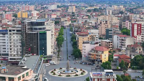 Aerial-view-of-fountain-and-roundabout-with-city-view-of-Shkoder,-Albania,-near-the-border-with-Montenegro