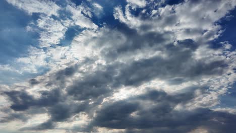 Dark-and-light-clouds-converge-in-a-dramatic-display-over-Crimea's-vast-skies,-creating-a-captivating-visual-tapestry-under-the-late-afternoon-sun