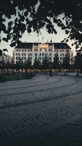 Vertical-view-of-Copenhagen's-iconic-square-at-Kongens-Nytorv-on-a-summer-evening