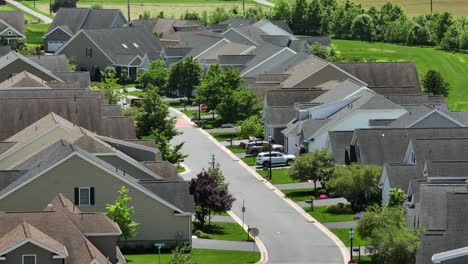 Zoom-drone-shot-of-modern-homes-and-houses-in-street-with-green-trees