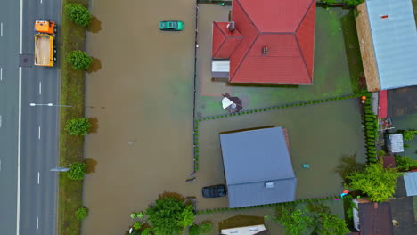 Flooded-living-area-of-private-homes-in-Jelgava,-Latvia,-aerial-drone-view