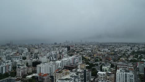 Storm-clouds-cover-Santo-Domingo-in-Dominican-Republic-as-Hurrican-Beryl-rolls-over-apartments,-aerial