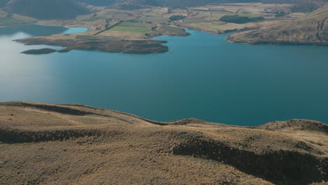 Lake-Coleridge-And-Mountains-In-Canterbury-New-Zealand-Drone-Pan-Up