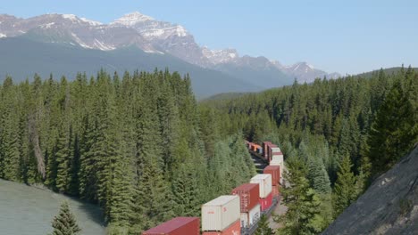 Container-freight-transportation,-Banff-National-Park-location,-aerial