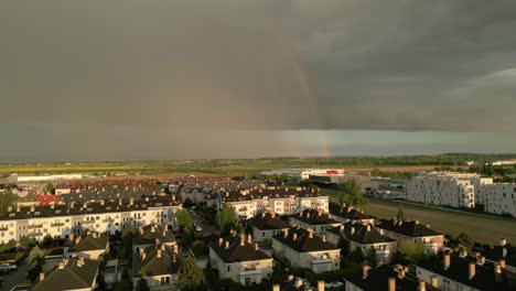 Rainbow-Against-Storm-Cloud-Over-The-Field-Nearby-Szczecin-In-Poland