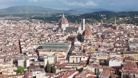 Florence-Cathedral-of-Santa-Maria-del-Fiore,-aerial-over-Duomo-and-Italian-neighborhood