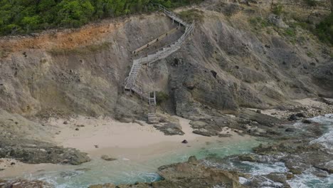 Forward-moving-wooden-stairway-on-shore-of-Carribean-Sea-in-St