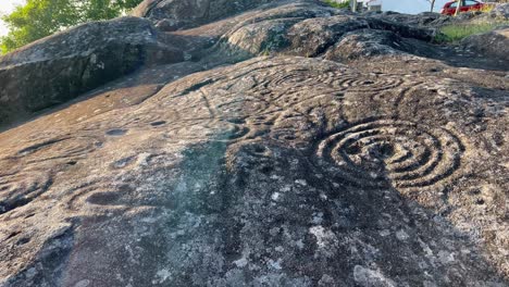 Shot-capturing-vintage-archaeological-carvings-on-stone-during-afternoon