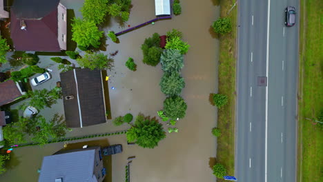 Flooded-houses,-flood-affected-by-rainfall-natural-disaster,-river-bursts-overflow,-aerial