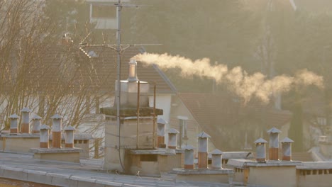 White-smoke-billowing-from-house-chimney