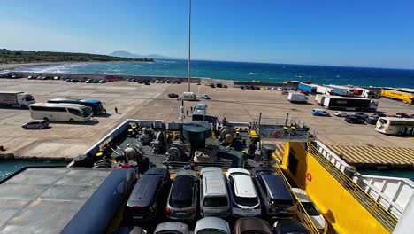 Static-shot-of-vehicles-being-transported-by-Port-of-Zakynthos-in-Greece