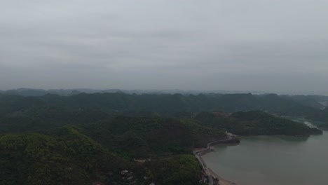 Aerial-View-of-village-on-Cat-Ba-Island,-Vietnam-near-Ha-Long-Bay-and-Lan-Ha-Bay