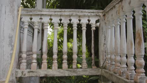 Derelict-handrails-of-abandoned-mansion,-motion-view