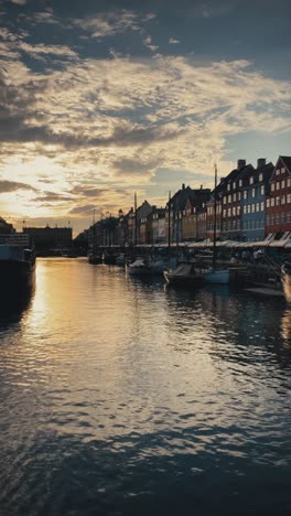 Vertical-view-of-Copenhagen's-canal-at-Nyhavn-at-sunset