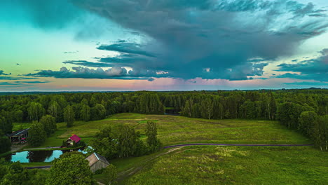 Lakes-Surrounded-By-Vegetation-With-Cabins-On-Lakeside-At-Sunset