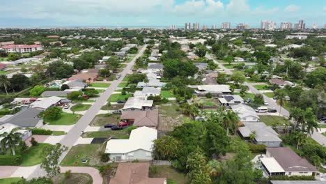 Aerial-flyover-luxury-upscale-neighborhood-in-Naples-with-palm-trees