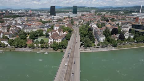 4K-Drone-Video-of-Traffic-Driving-on-Wettsteinbrücke-Bridge-over-the-Rhine-River-in-Basel,-Switzerland