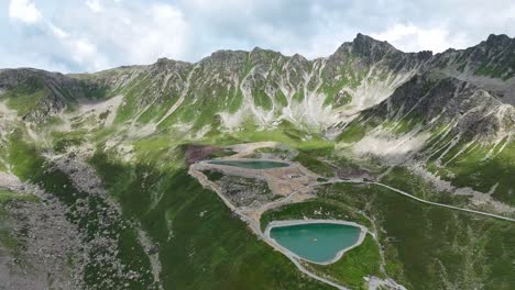 Aerial-establishing-shot-of-small-mountain-lakes-in-Austrian-Alp-Mountains-in-summer