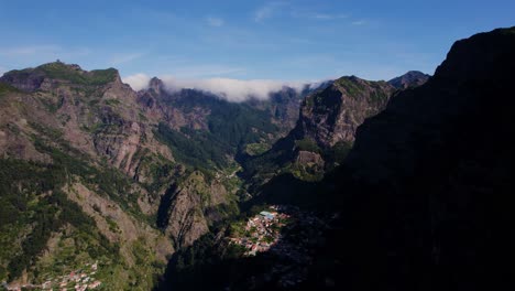 Aerial-view-of-a-small-town-in-the-middle-of-mountain-range