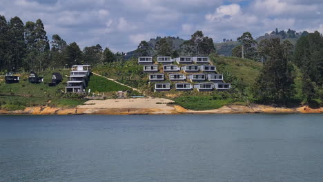 Modern-Apartment-Buildings-on-Coast-of-Guatape-Lake,-Colombia