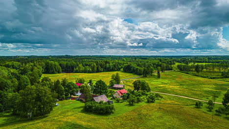 Homestead-Around-Pond-In-Countryside-With-Cloudy-Skies