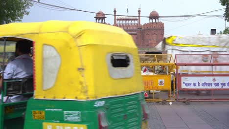 Famous-tourist-destination-Red-Fort-busy-road-in-Chandni-Chowk,-North-Delhi-Police-barricades