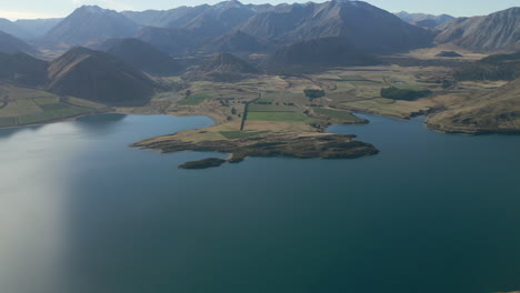 Farms-At-The-Edge-Of-Lake-Coleridge-New-Zealand-Tracking-In