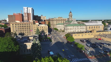 Downtown-Portland,-Maine-historic-buildings-skyline,-under-clear-blue-sky,-sideways-tracking