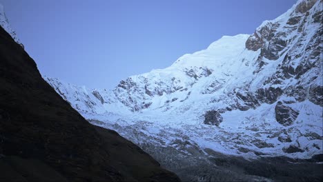 Blue-Snowcapped-Mountains-at-Night-in-Nepal,-Snowy-Himalayas-Mountain-Range-in-the-Dark-at-Night-with-Snow-Covered-Ridge-in-Blue-Night-Time-Shot-of-Mountain-Landscape-with-Big-Peaks-and-Summit