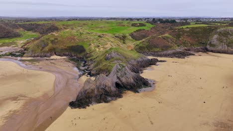 Shoreline-of-sand-dunes,-salt-marsh-and-encrusted-with-rock-pools,-aerial