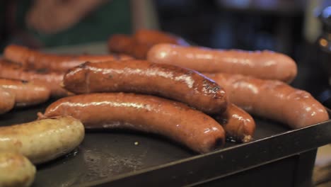 Sausages-on-the-grill.-Movement-slow-motion-shot