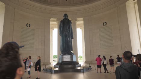 Looking-up-at-dome-ceiling-and-frieze-pan-down-to-Thomas-Jefferson-Memorial-statue,-Washington,-D