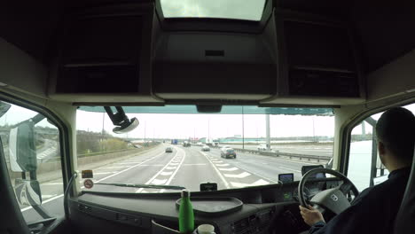 In-cab-view-of-a-HGV-driver-joining-the-M6-motorway-in-the-UK-from-the-spaghetti-junction,-Birmingham