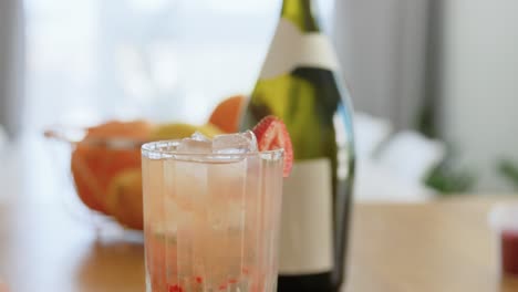 Woman-Making-Cocktail-Drinks-at-Home-Kitchen.drinks-and-people-concept--young-woman-making-strawberry-mojito-cocktail-at-home-kitchen