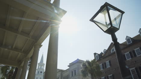 Lamp-Post-Sun-Flare-Downtown-Historic-Charleston,-Dolly