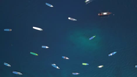 Aerial-top-overhead-shot-of-many-boats-near-the-beach-of-Gili-Trawangan-in-Bali